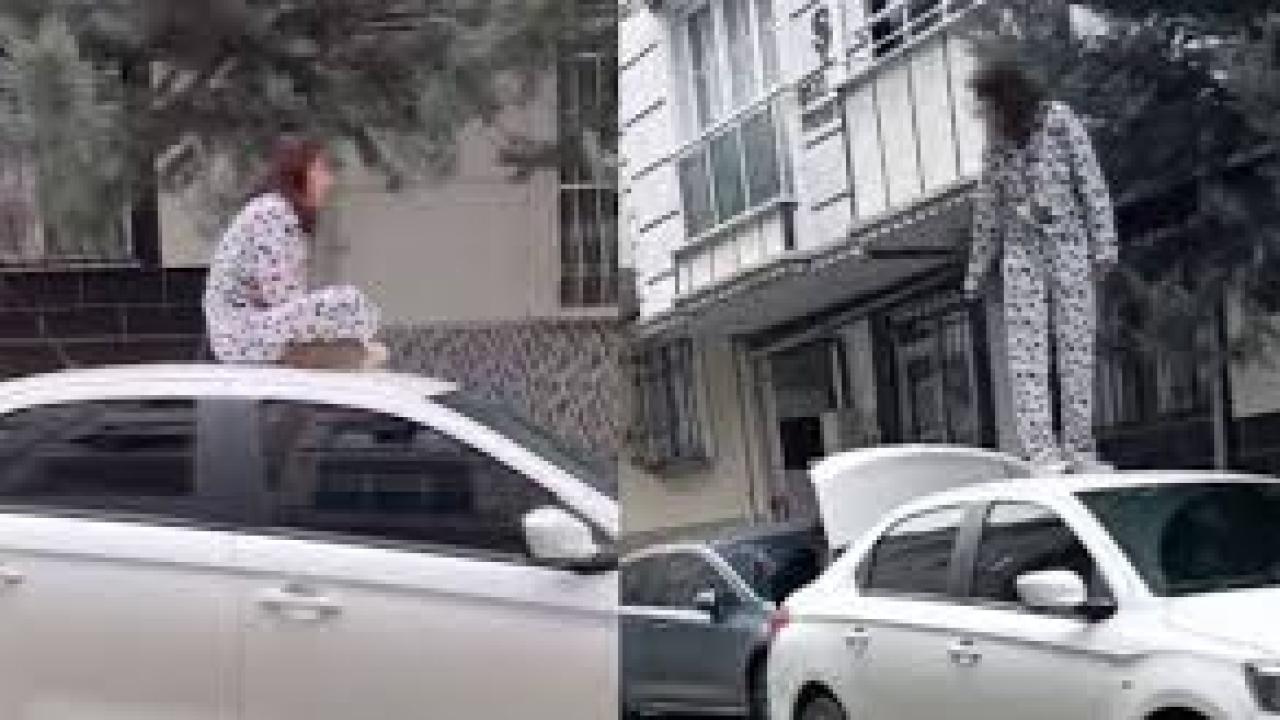 Sinir krizi geçiren kadın bir otomobilin üzerine çıkarak zıpladı